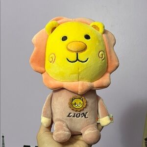 Yellow and orange lion plush toy